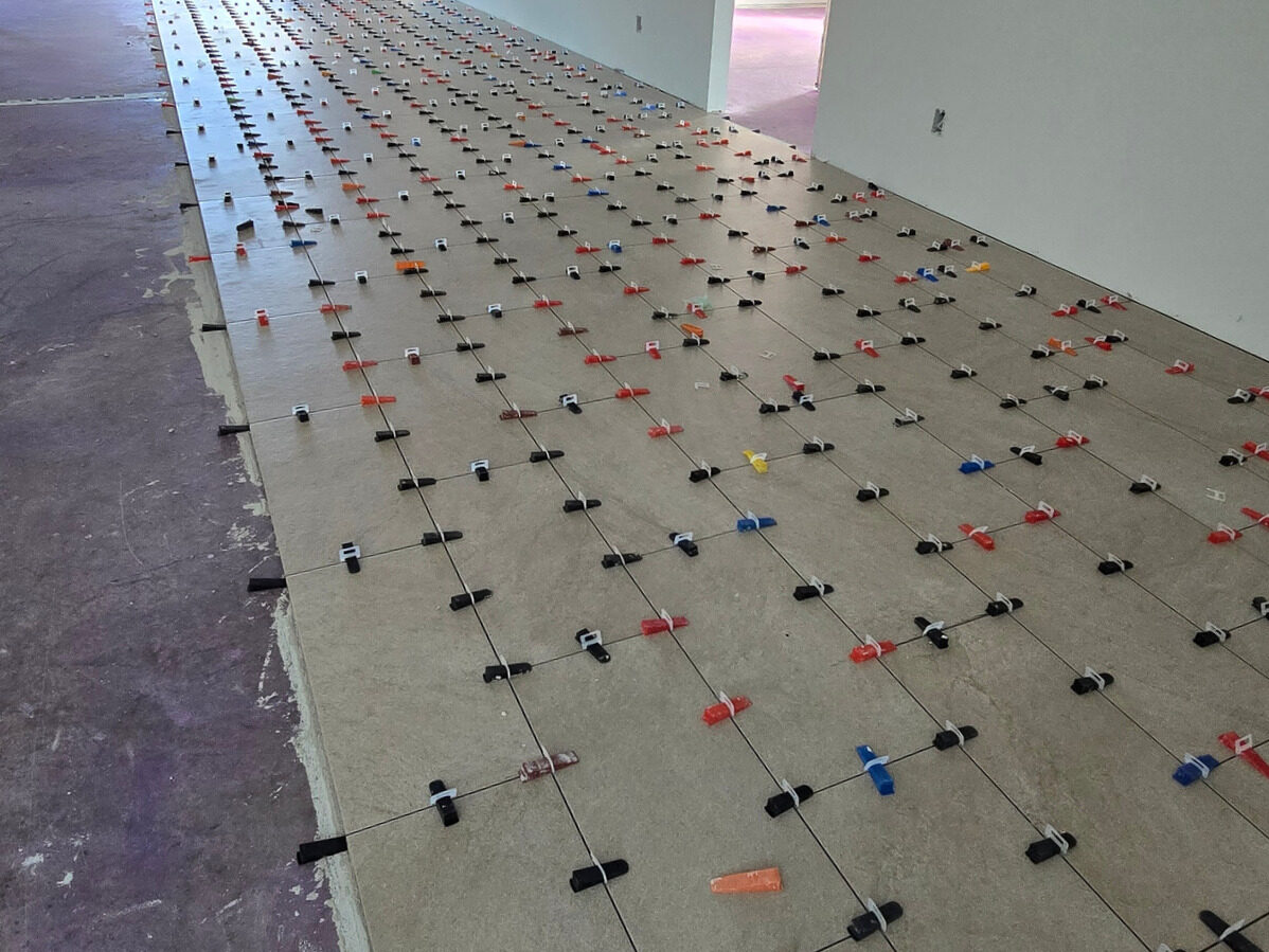 Tile flooring being installed in living areas