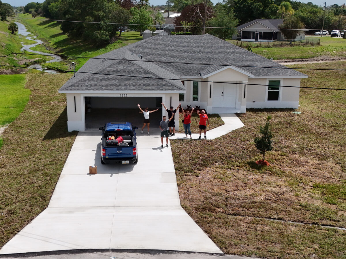 Happy homeowners celebrating on move-in day