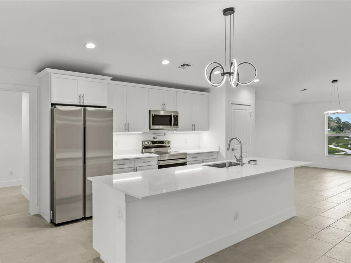 Finished kitchen with stainless steel appliances and modern fixtures