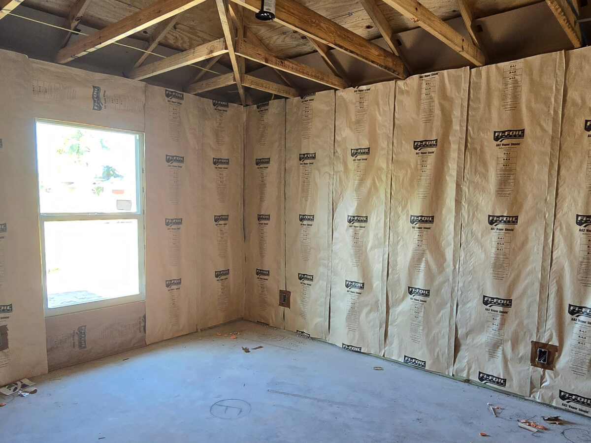 Fi-Foil vapor shield insulation installed on CMU walls before drywall