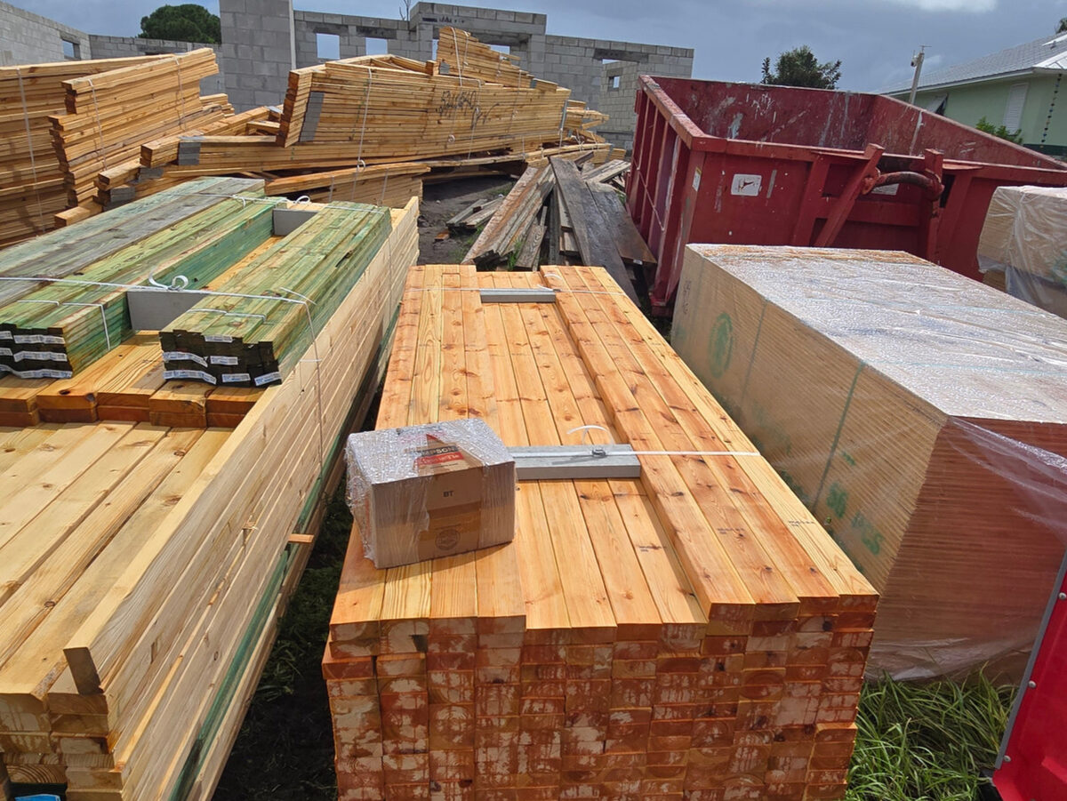 Lumber packages delivered and staged on site for framing