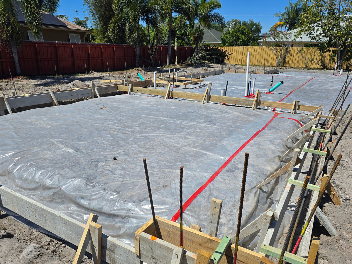 Close-up of rebar tied on chairs with vapor barrier below