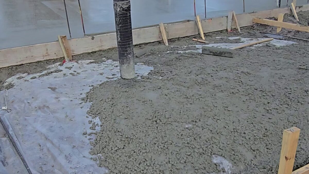 Concrete being poured for the monolithic slab