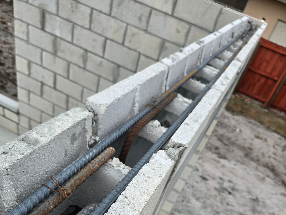 Top view showing rebar in CMU wall cells before pour