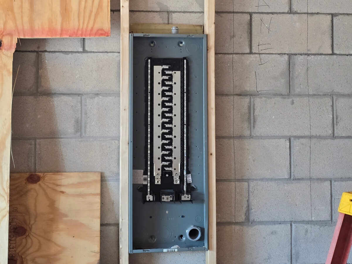 Electrical panel with organized circuit breakers and wiring