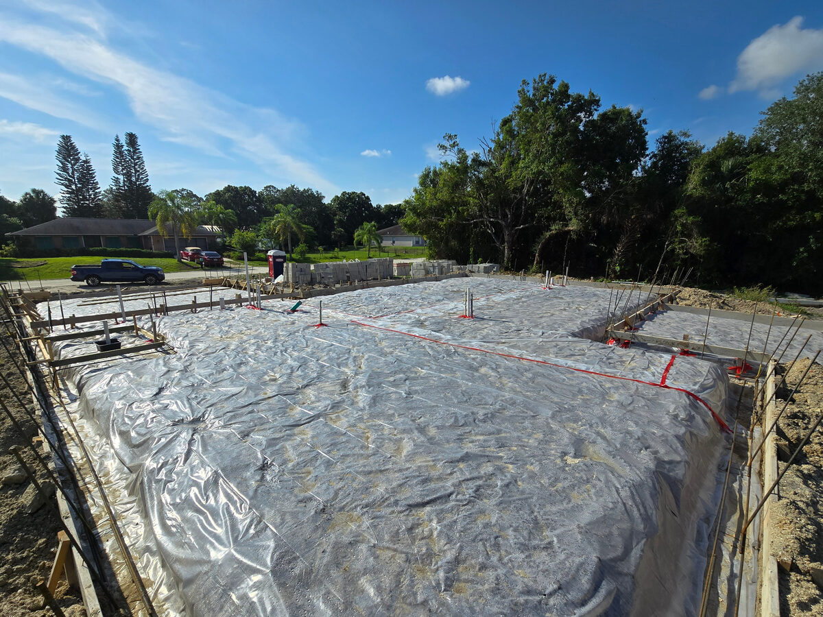 Aerial view of block walls being erected on the slab