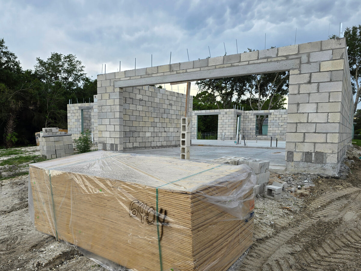 Block walls being filled with concrete for structural reinforcement