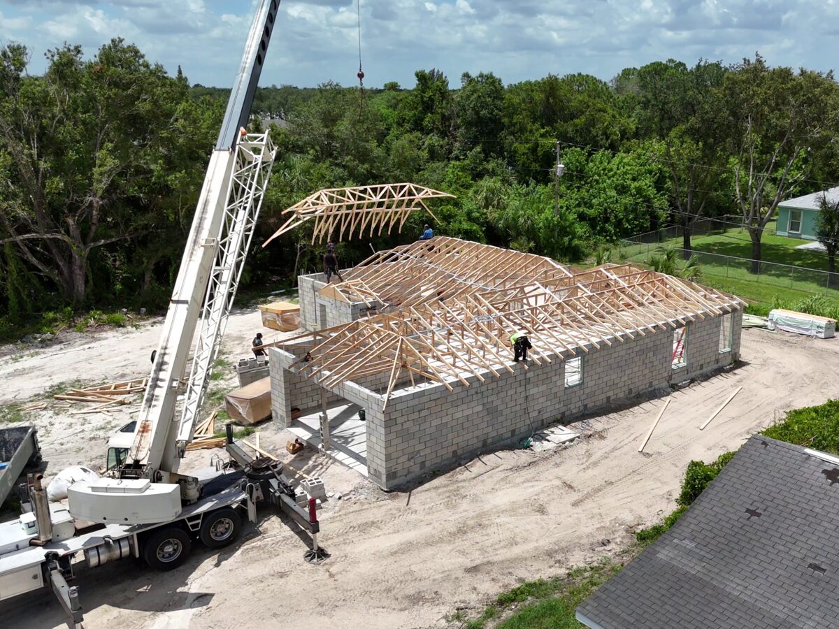 Lumber packages delivered and staged on site for framing
