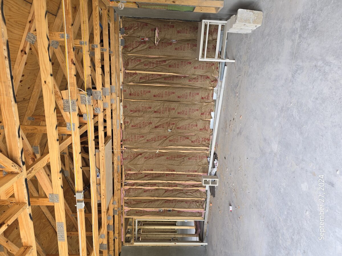 Drywall being hung on walls and ceiling