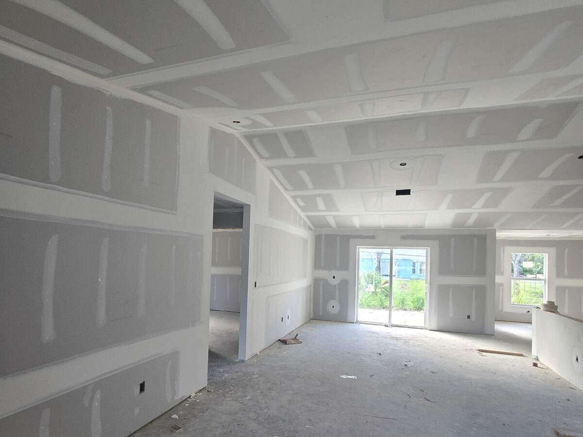 Porcelain tile flooring being installed throughout the home