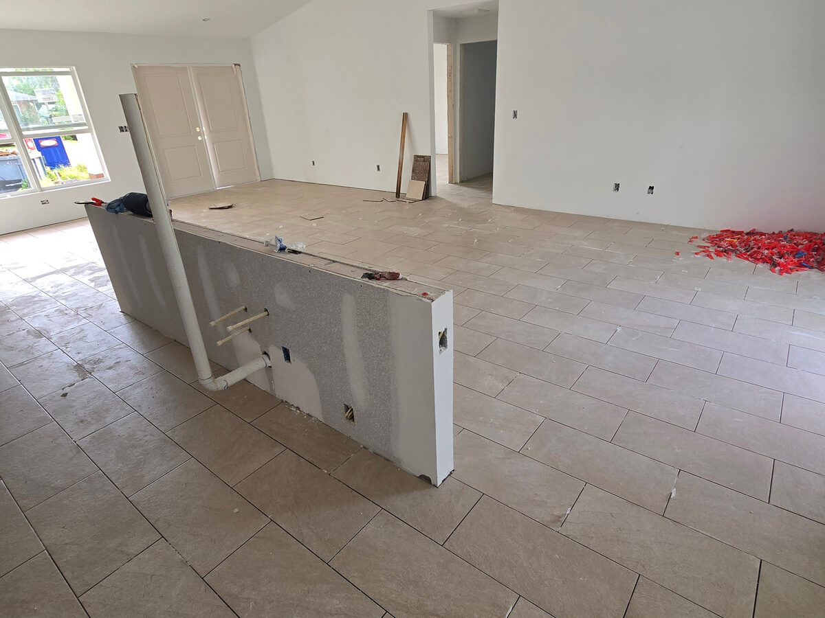 Bathroom vanity with modern fixtures and tile floor