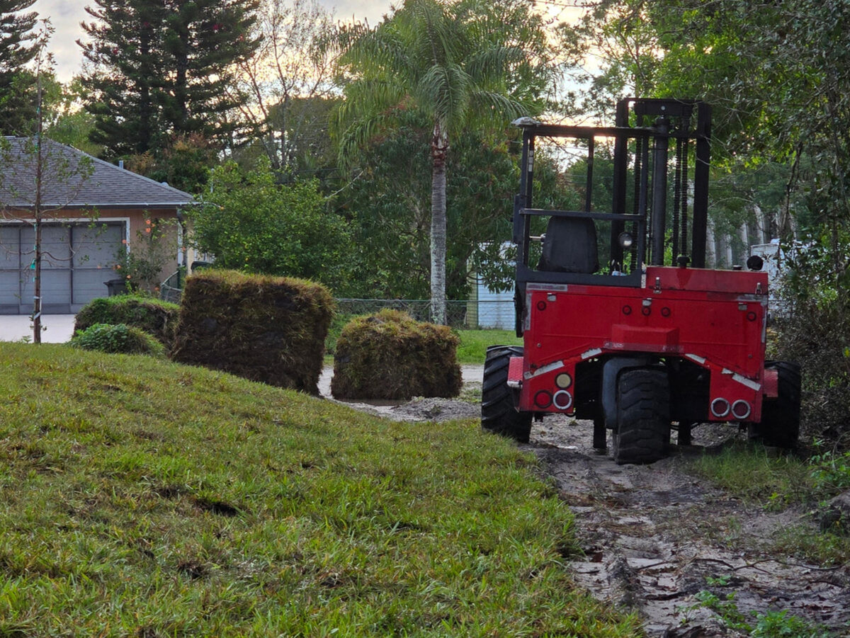 Landscaping in progress with fresh sod installation