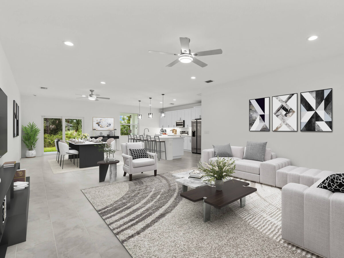 Virtually staged open-concept living and dining area with modern furniture, kitchen island and pendant lights